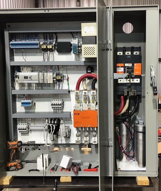 New industrial control panel with disconnect, contactors and capacitor bank before shipping