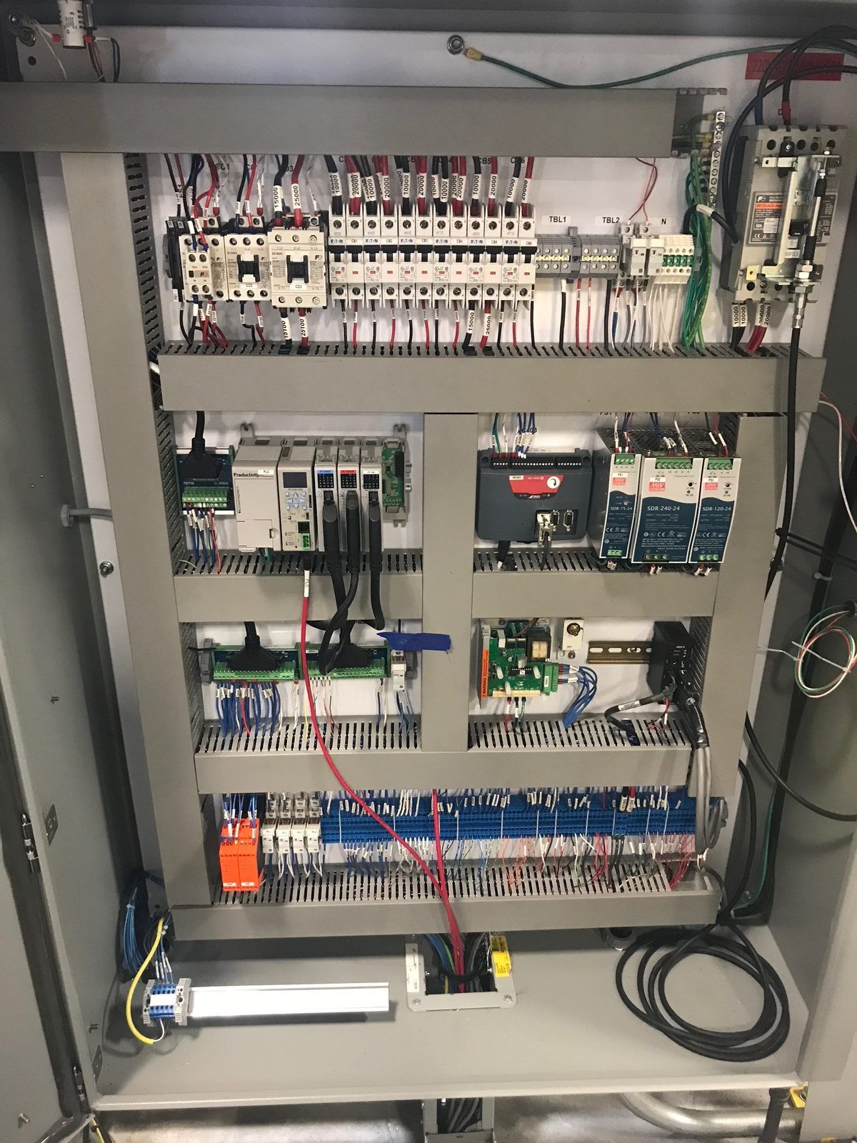 Control cabinet built for an X-ray machine, with PLC, power supplies and labeled terminal blocks